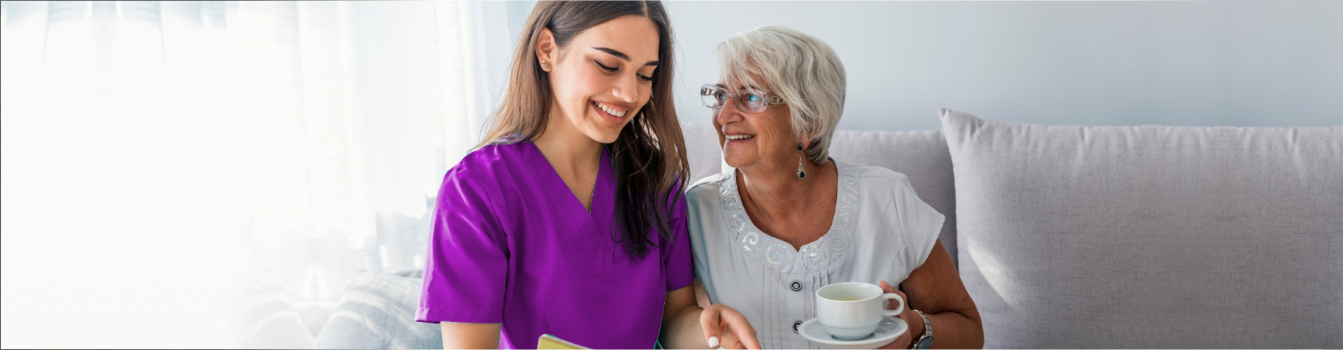 senior and caregiver smiling