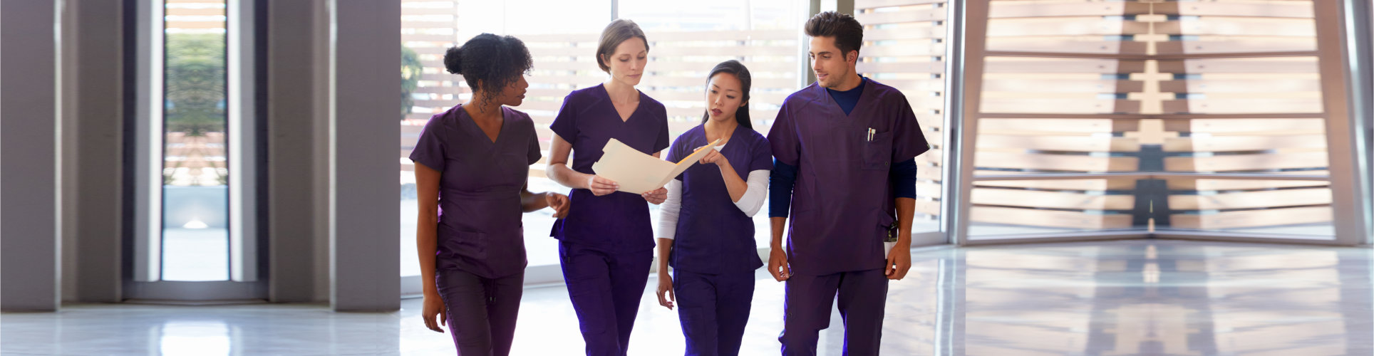 group of caregiver discussing while walking